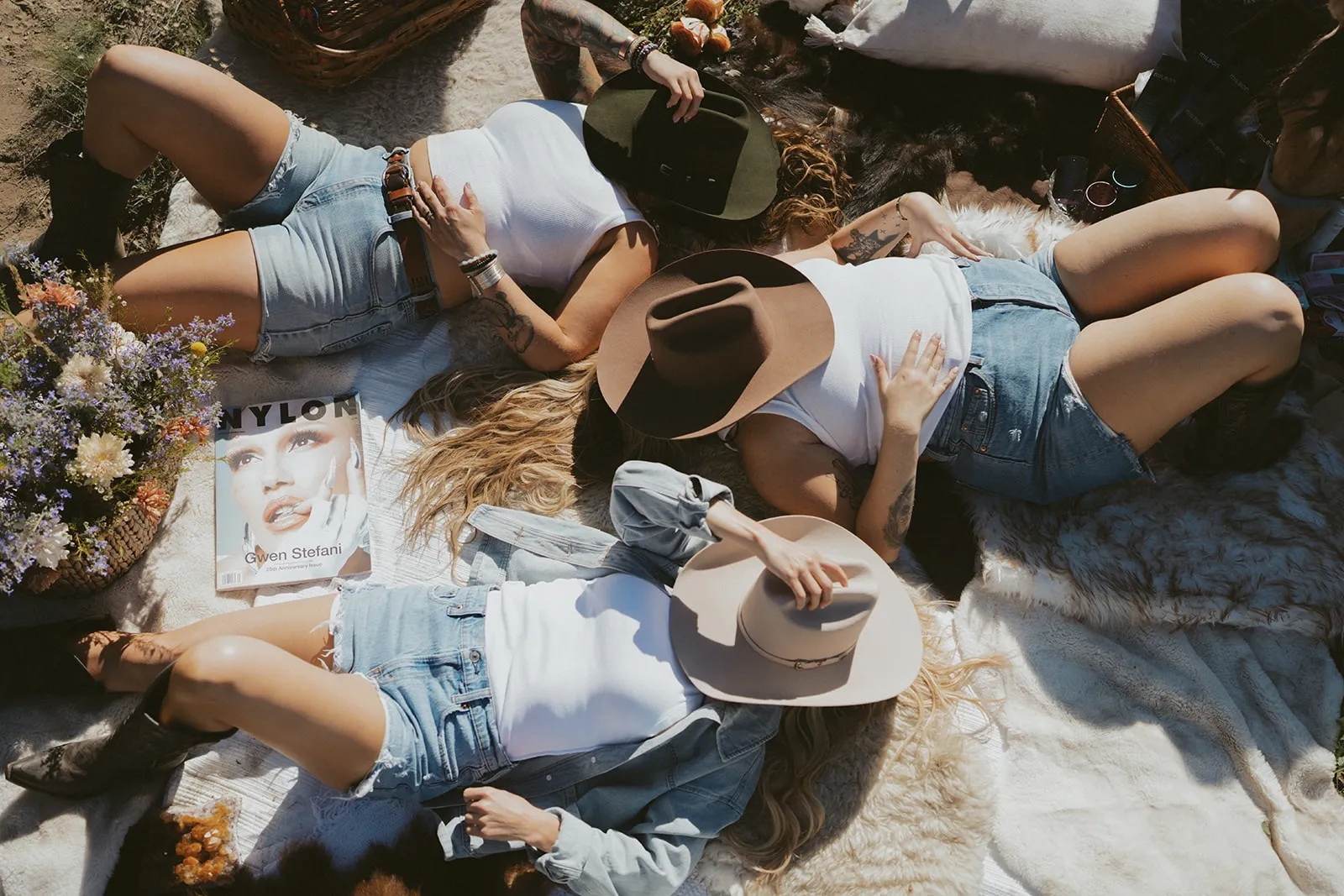 Three women relaxing at a western-themed picnic